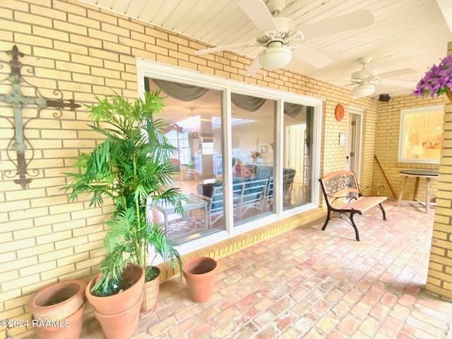 view of patio featuring ceiling fan