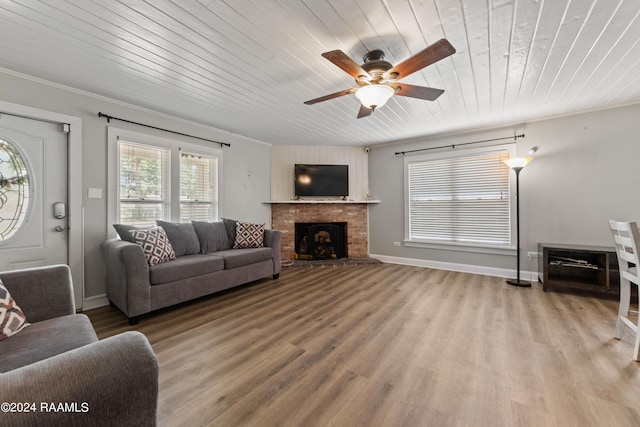 living room with a fireplace, wood ceiling, hardwood / wood-style floors, and ceiling fan