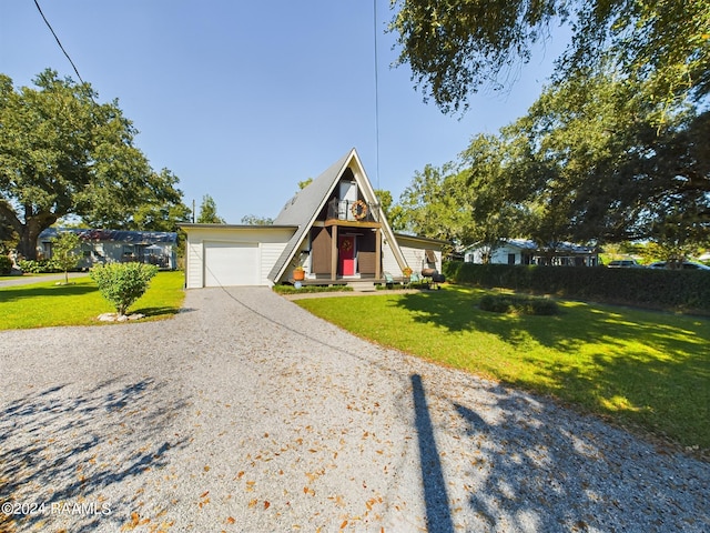 view of front of house featuring a front yard and a garage