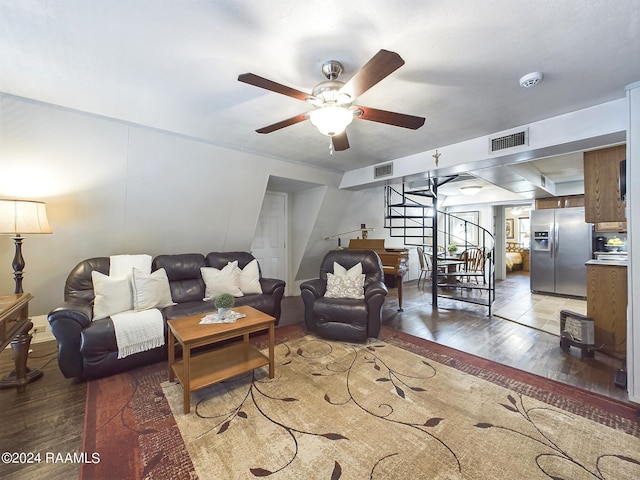 living room with hardwood / wood-style flooring and ceiling fan