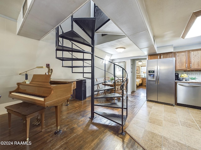 stairway featuring wood-type flooring