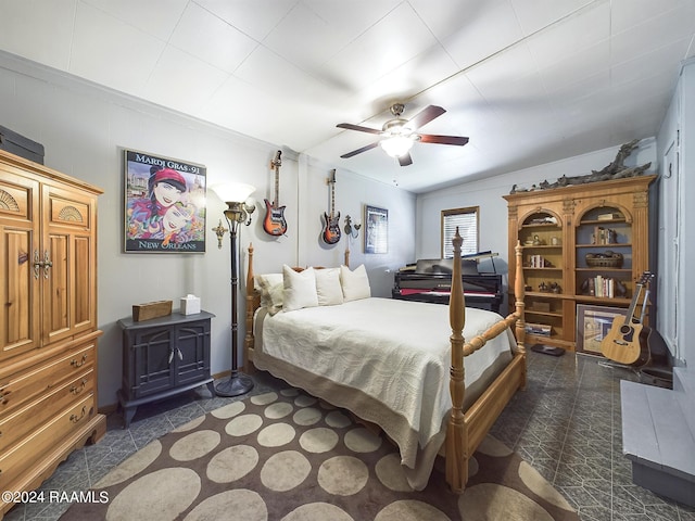 bedroom featuring ceiling fan and ornamental molding