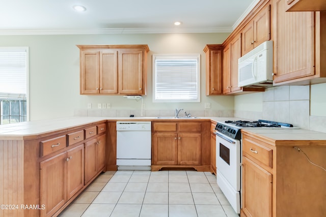 kitchen featuring light tile patterned floors, sink, kitchen peninsula, and white appliances