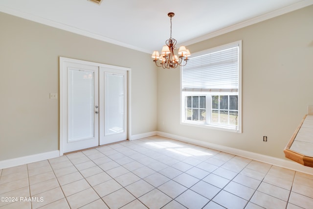 spare room featuring a chandelier, light tile patterned floors, and crown molding