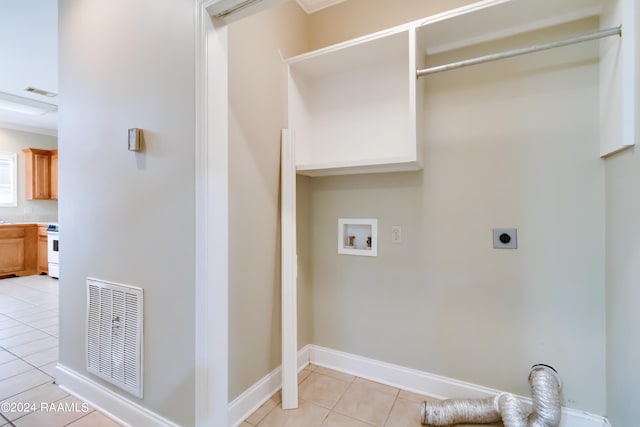 laundry room with washer hookup, light tile patterned floors, and electric dryer hookup