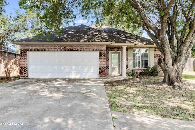 ranch-style house featuring a garage