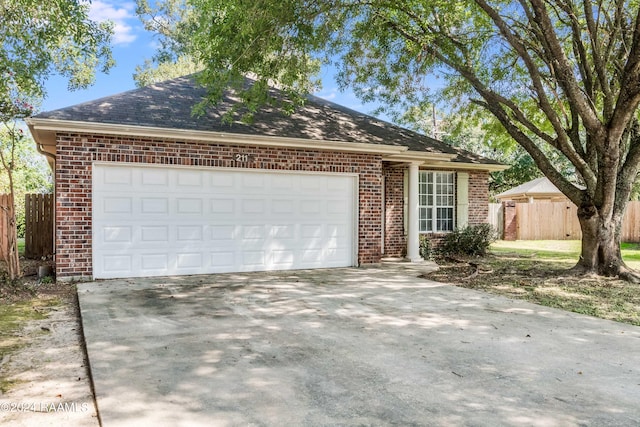 ranch-style house featuring a garage