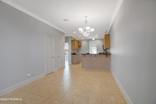 interior space with an inviting chandelier, light tile patterned flooring, and ornamental molding