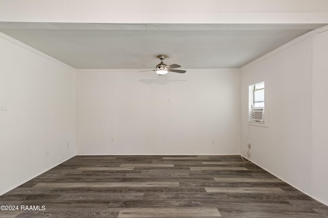 spare room featuring dark wood finished floors, cooling unit, crown molding, and a ceiling fan