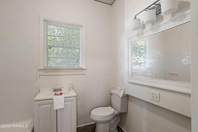 half bathroom featuring toilet and vanity