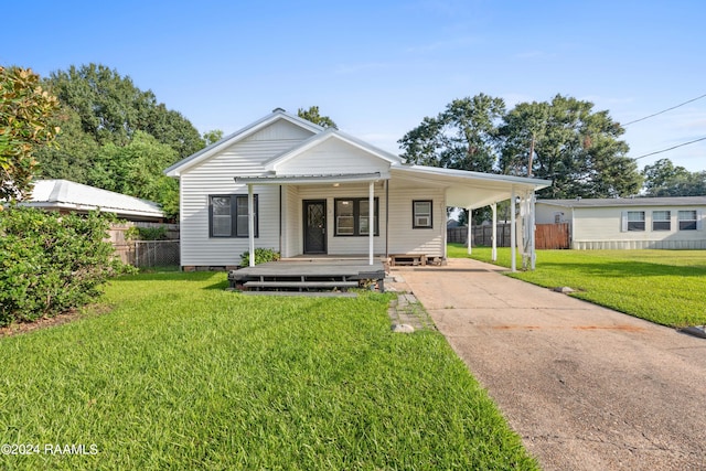 bungalow with a carport and a front lawn