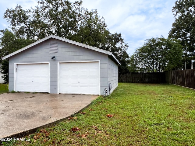 garage with a yard