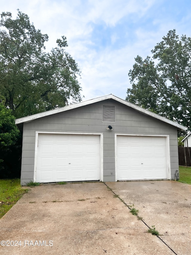 garage featuring wood walls