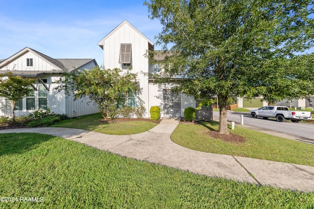 view of front of home with a front yard