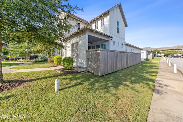 view of property exterior with a lawn