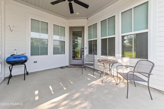 view of patio with ceiling fan and a grill