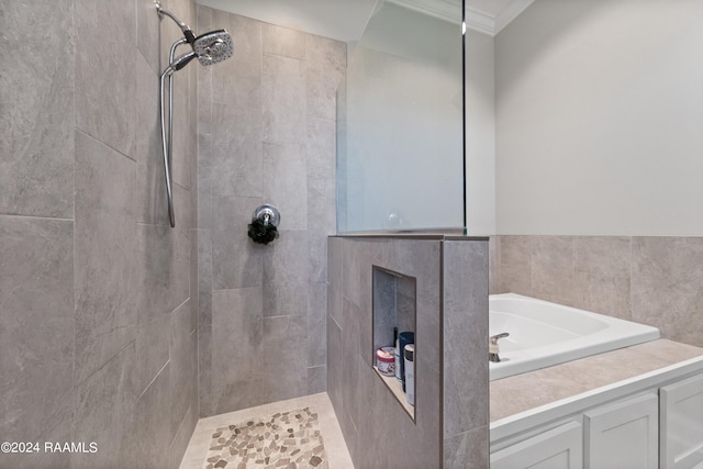 bathroom with shower with separate bathtub and ornamental molding