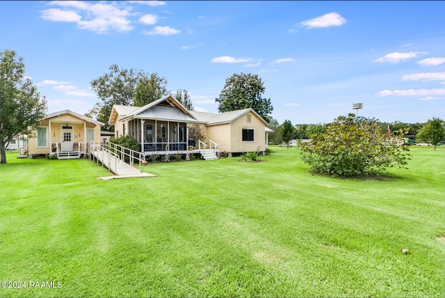 view of yard featuring a sunroom