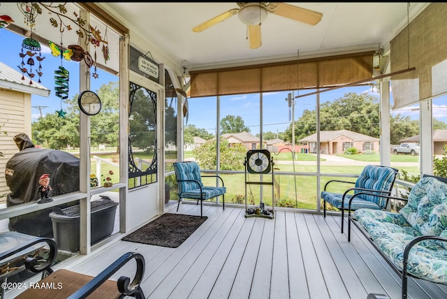 sunroom / solarium with ceiling fan