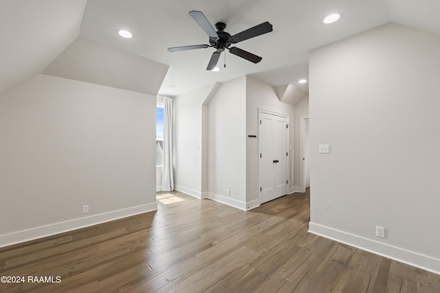 bonus room with wood-type flooring, lofted ceiling, and ceiling fan