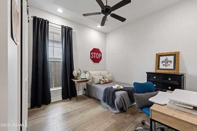 bedroom featuring ceiling fan and light hardwood / wood-style flooring