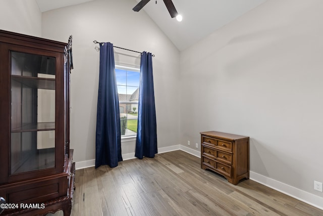 spare room with vaulted ceiling with beams, ceiling fan, and light hardwood / wood-style flooring