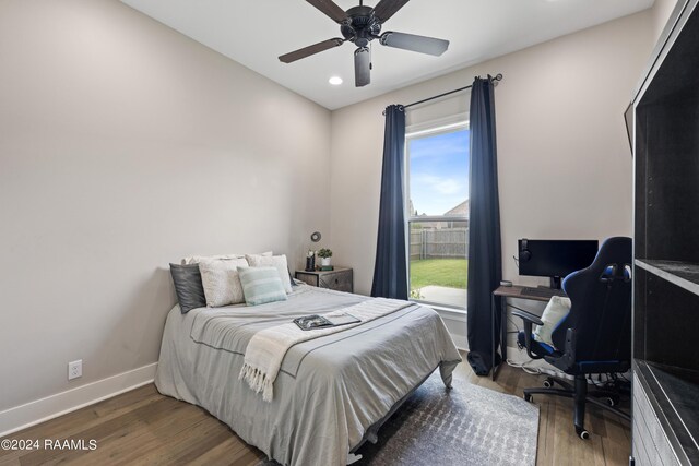 bedroom with ceiling fan and hardwood / wood-style flooring