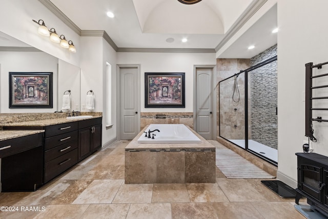 bathroom featuring crown molding, vanity, and independent shower and bath