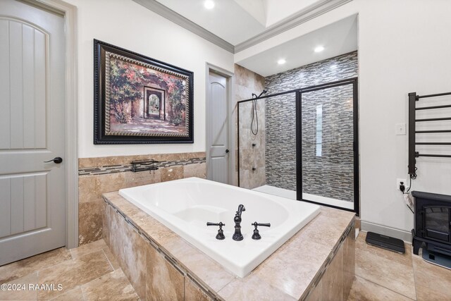 bathroom with crown molding, radiator heating unit, and separate shower and tub