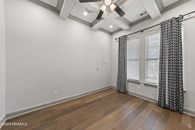 spare room featuring crown molding, dark hardwood / wood-style flooring, beamed ceiling, coffered ceiling, and ceiling fan