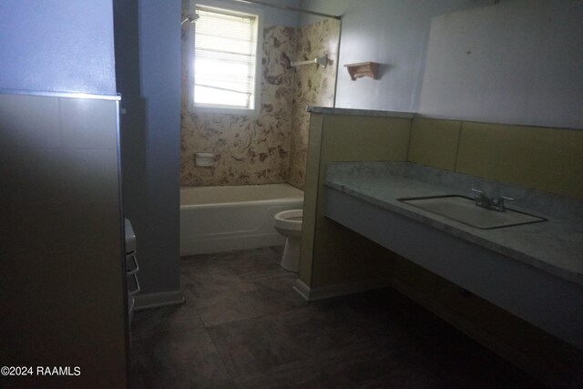 full bathroom with tile patterned floors, toilet, shower / washtub combination, and vanity