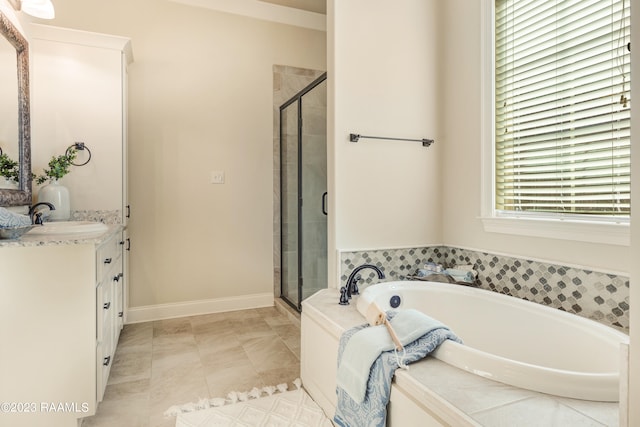 bathroom with vanity, tile patterned floors, and plus walk in shower