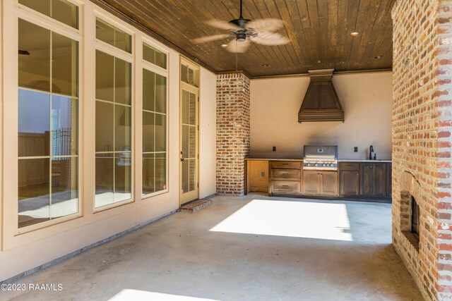 view of patio with area for grilling, ceiling fan, sink, and exterior kitchen