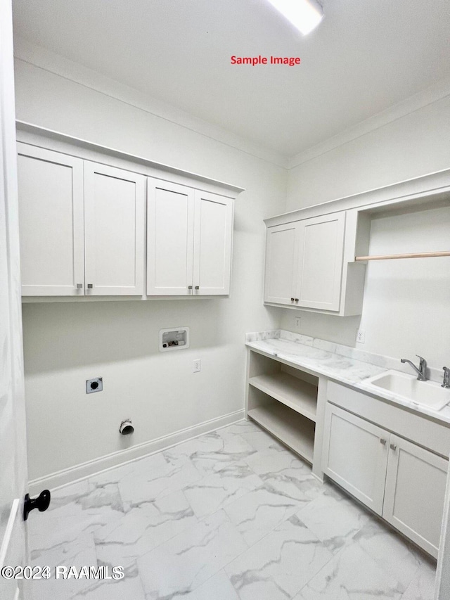 laundry area with sink, crown molding, cabinets, electric dryer hookup, and washer hookup