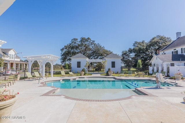 pool featuring a patio area, fence, and a pergola