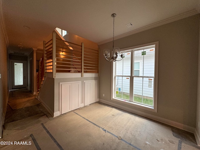 unfurnished dining area featuring ornamental molding, a healthy amount of sunlight, and an inviting chandelier