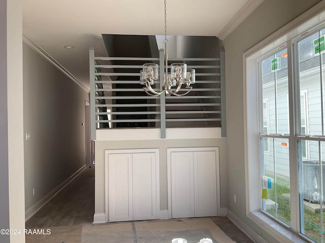 room details with ornamental molding and a notable chandelier