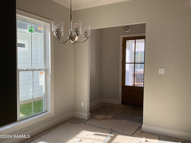 interior space with a chandelier and crown molding