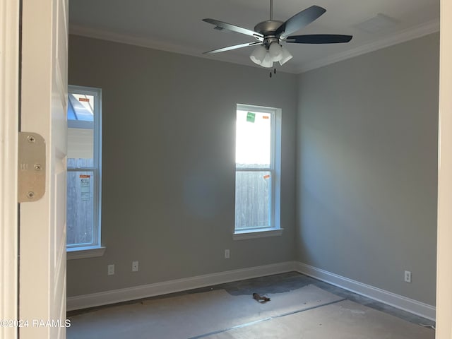 empty room featuring crown molding and ceiling fan