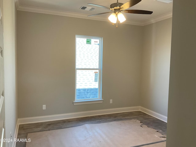 spare room featuring hardwood / wood-style flooring, ceiling fan, and crown molding