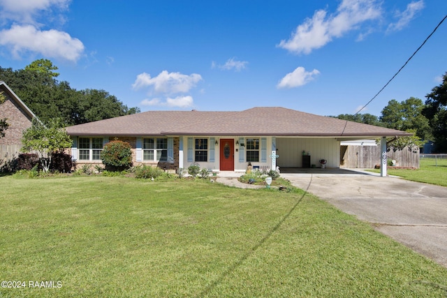 single story home with a front yard, a porch, and a carport