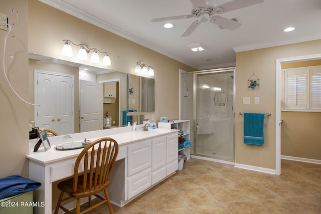 bathroom featuring tile patterned flooring, crown molding, vanity, a shower with door, and ceiling fan