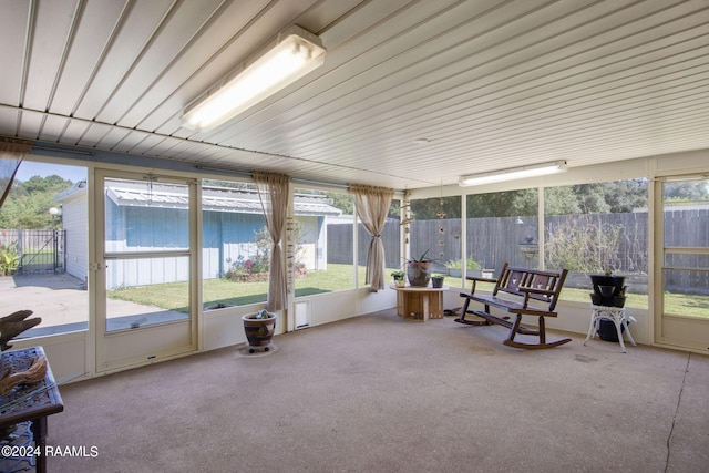 sunroom / solarium featuring a healthy amount of sunlight