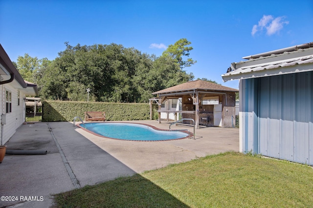 view of swimming pool with a yard, a patio area, and a gazebo