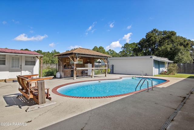 view of swimming pool featuring a patio area