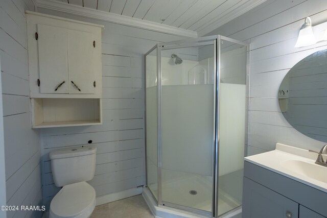 bathroom with wood walls, walk in shower, vanity, and toilet