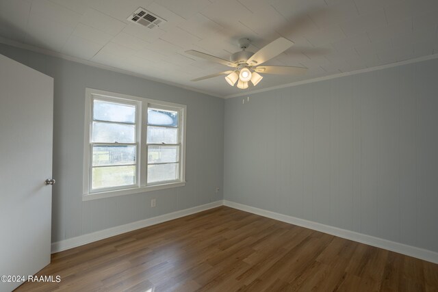 spare room featuring ceiling fan, hardwood / wood-style flooring, and ornamental molding