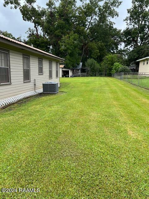 view of yard with central AC unit