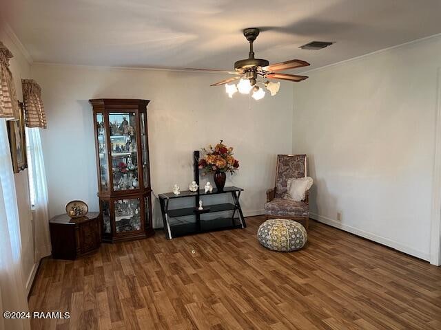 unfurnished room featuring ornamental molding, dark hardwood / wood-style flooring, and ceiling fan