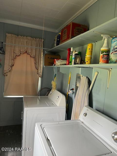 clothes washing area featuring washer and dryer